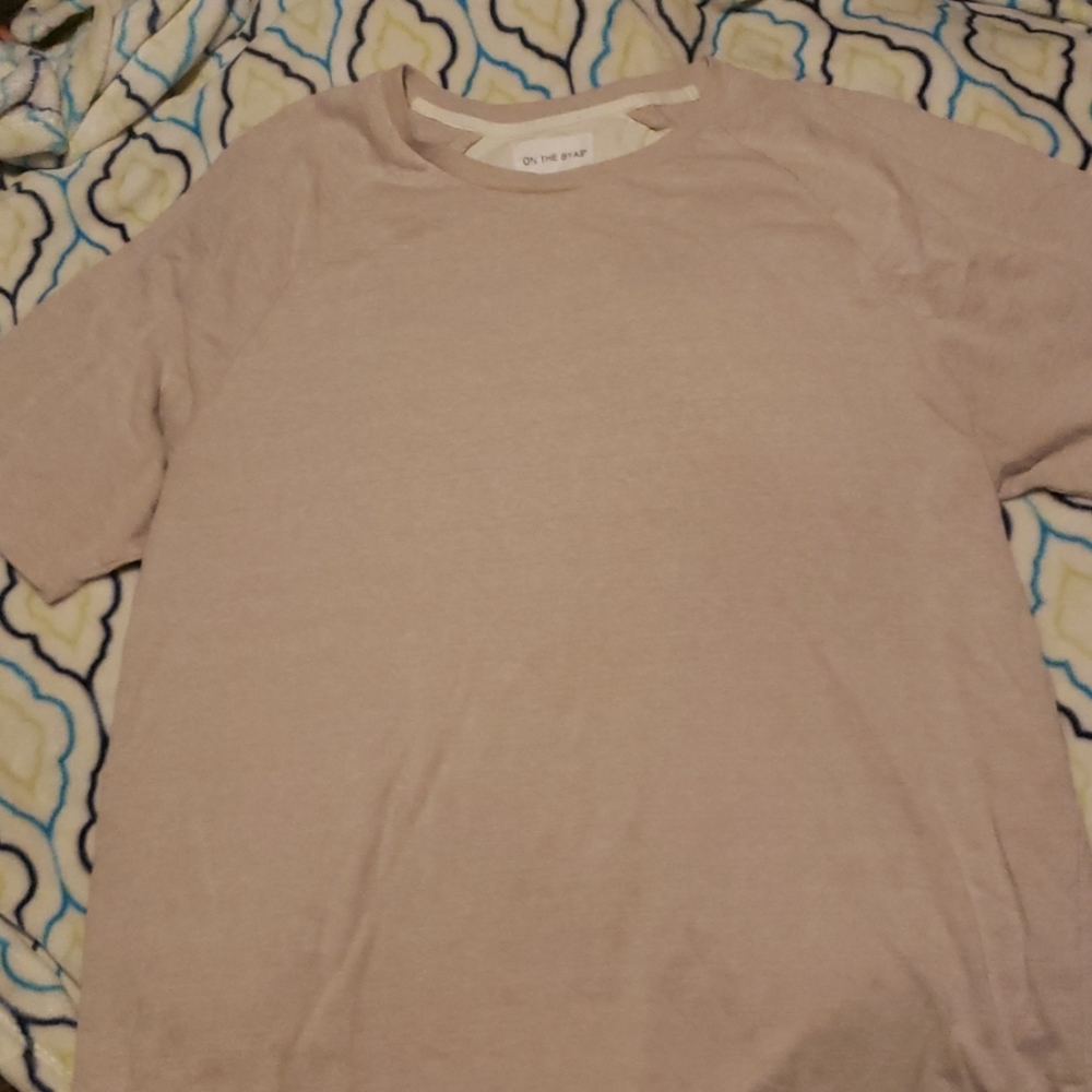 On The Byas cream colored short sleeve tee-shirt